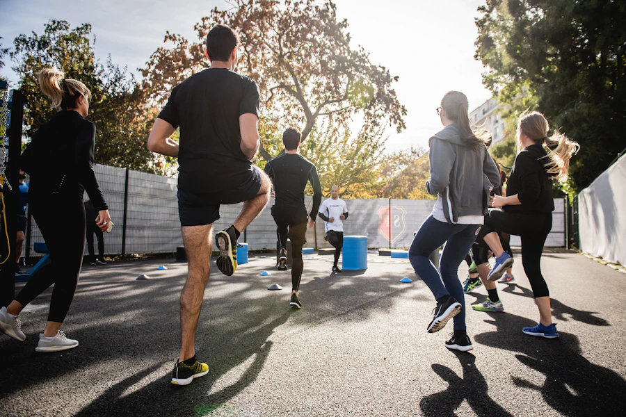 A small group doing lunges outdoors in morning sun